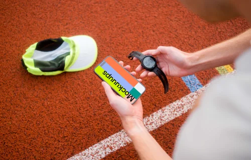 Runner holding sport watches and iPhone 14 Pro mockup