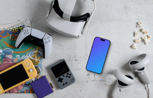 Smartphone mockup amidst gaming gear and snacks