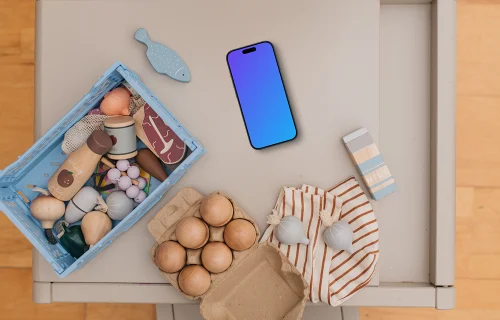 Smartphone mockup among children's toys