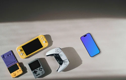 Smartphone mockup among gaming devices on neutral background
