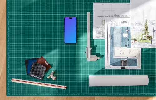Smartphone mockup on architect's planning table