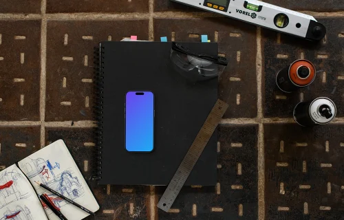 Smartphone mockup with architect tools and sketches