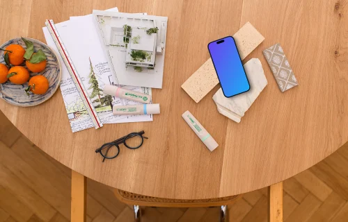 Smartphone mockup with architect's blueprint and tools
