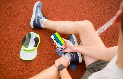 Sport mockup with athlete holding a phone