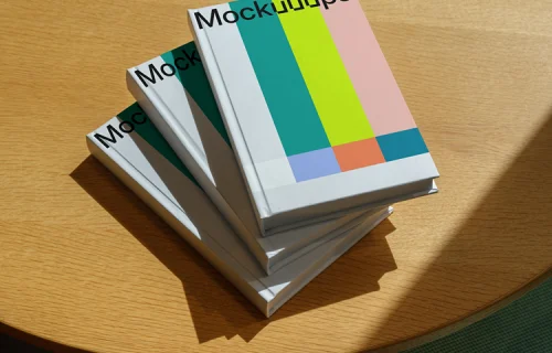 Stacked B-format book mockup on a sunlit wooden table