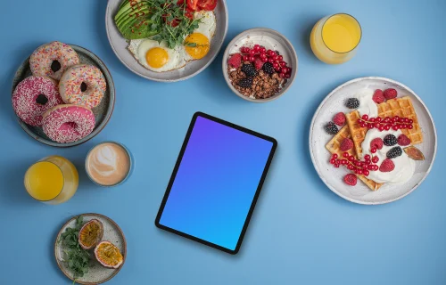 Tablet mockup around delicious breakfast meals