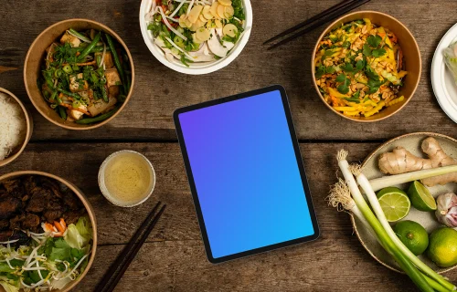 Tablet mockup in the middle of Vietnamese cuisine dishes