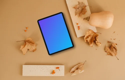 Tablet mockup next to the brick and pumpkin