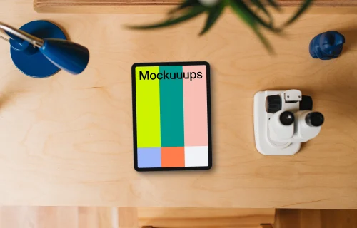 Tablet mockup on a child-friendly desk with educational tools