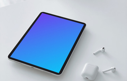 Tablet mockup on a table with a pair of Airpods 2