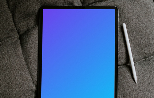 Tablet mockup on an gray sofa