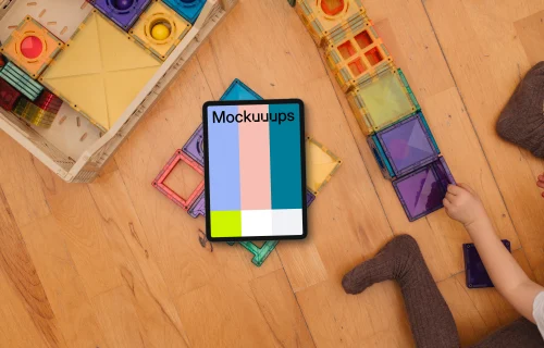 Tablet mockup surrounded by colorful children's blocks