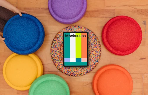 Tablet mockup surrounded by colorful kids seat cushions