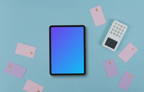 Tablet mockup surrounded by credit card and payment terminal