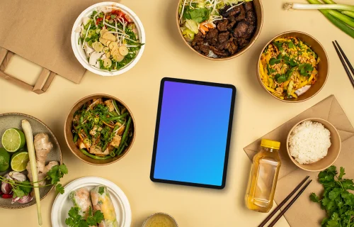 Tablet mockup surrounded by vietnamese food 