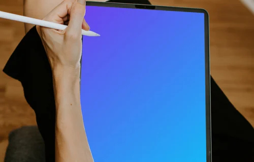Tablet mockup with Apple pencil held by lady