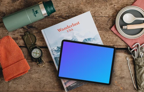Tablet mockup with hiking supplies