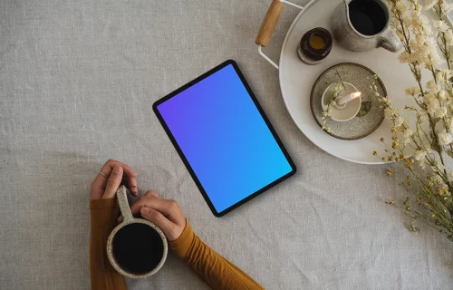 Top view of woman reading on tablet mockup