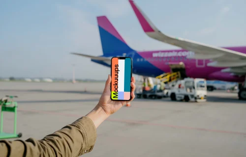 User holding an iPhone mockup