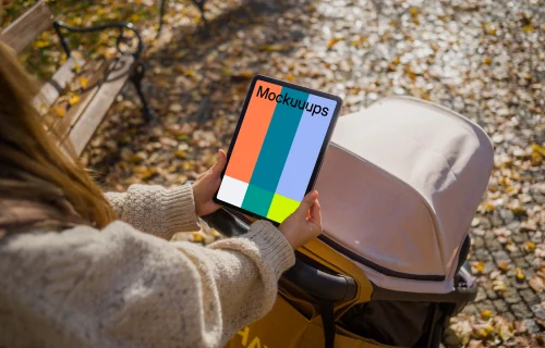 Woman hands holding an iPad Air in autumn season mockup