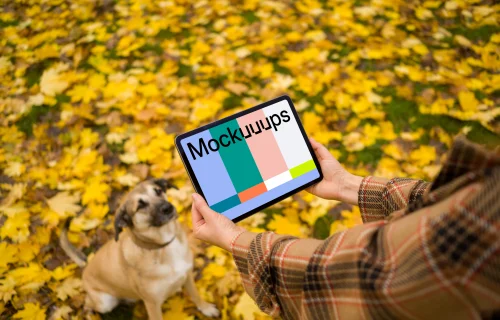 Woman hands holding an iPad near cute dog mockup