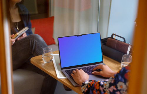 Woman typing on a MacBook Pro 14 mockup