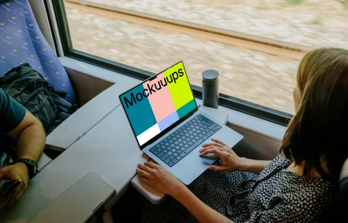 Woman working on a MacBook Pro mockup