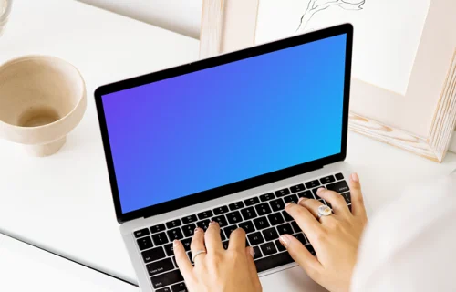 Young lady typing on a MacBook Pro mockup