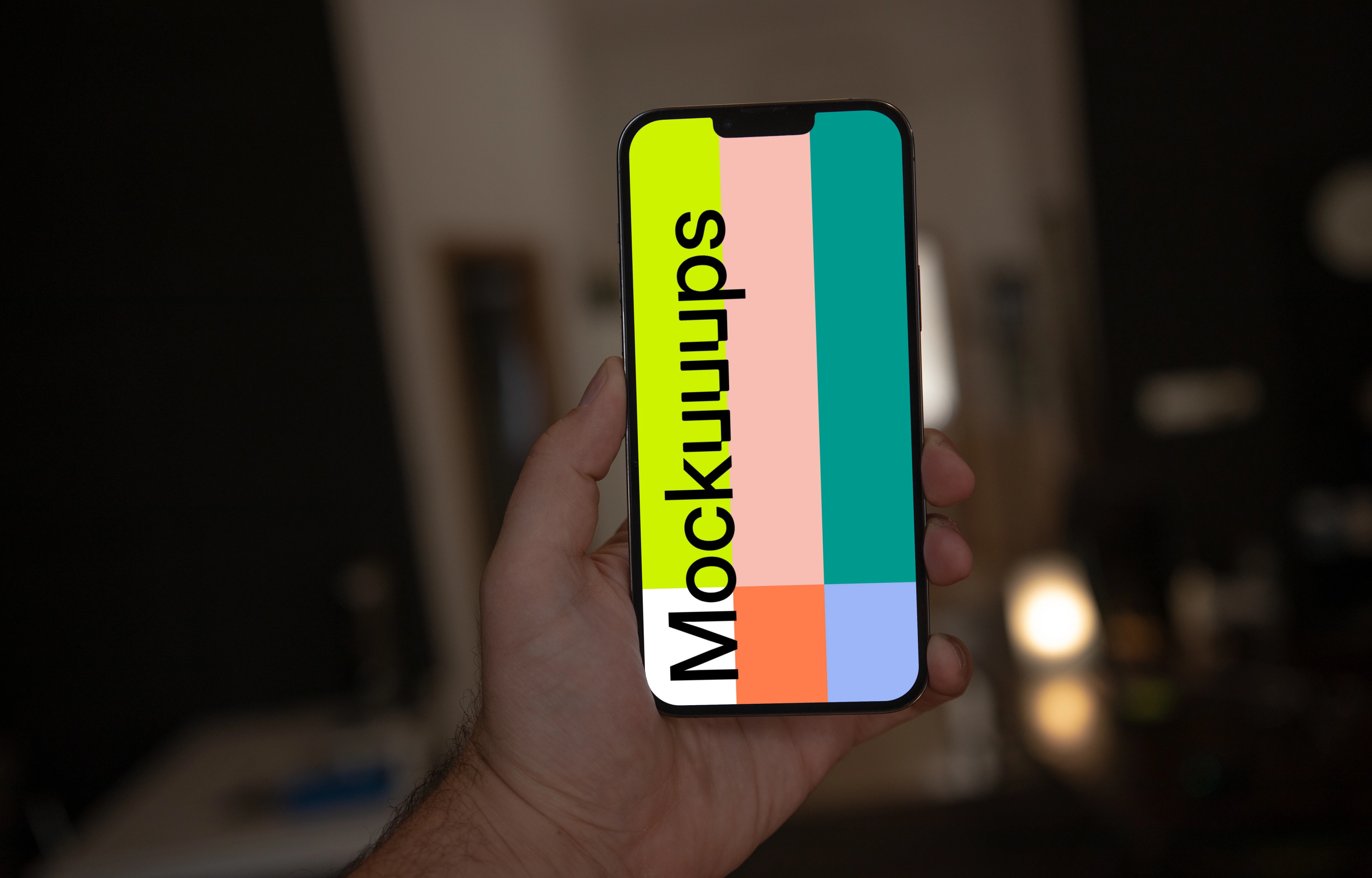 Hand holding iPhone 13 Pro mockup