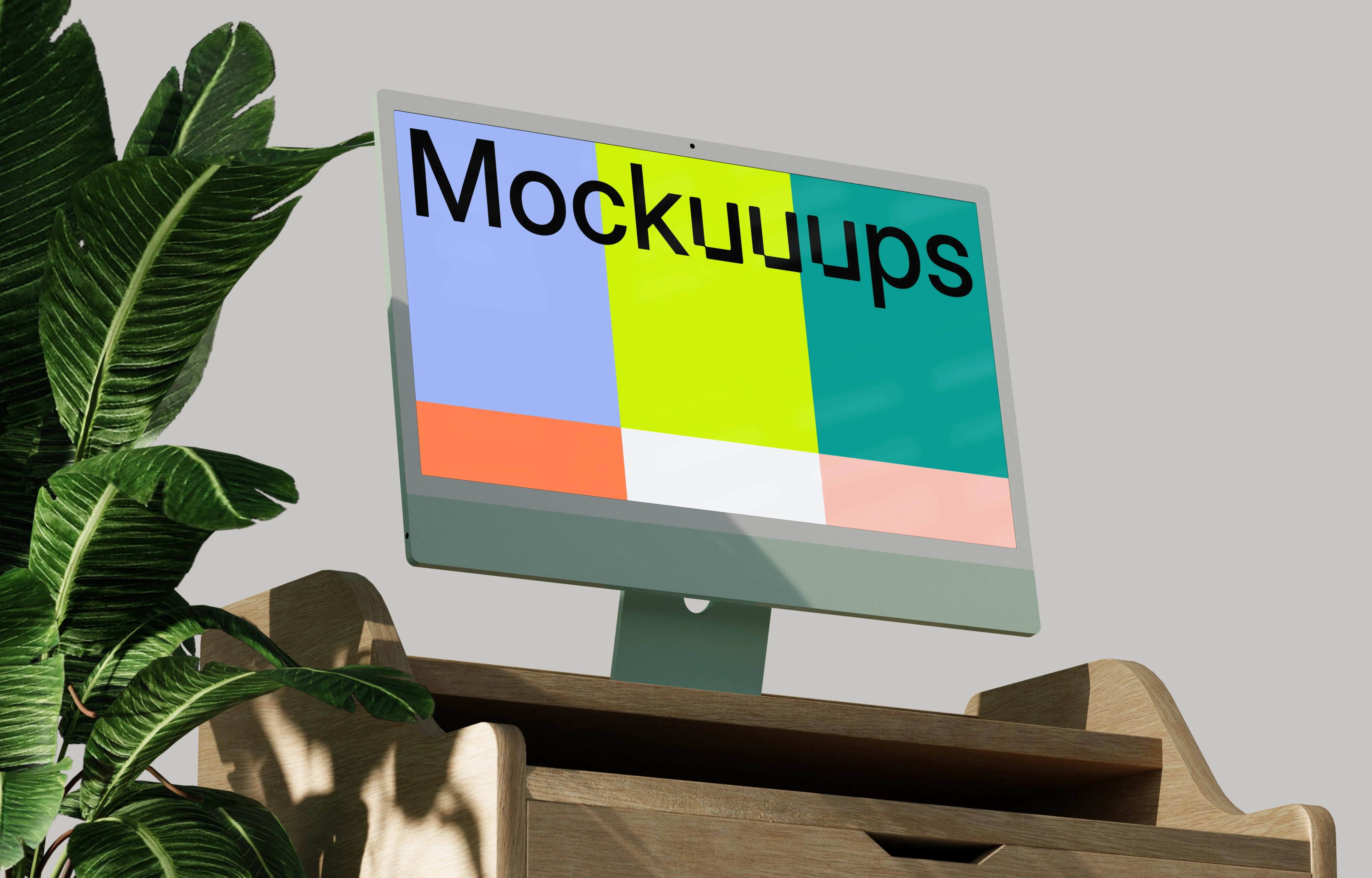iMac mockup on a wooden desk with indoor plant