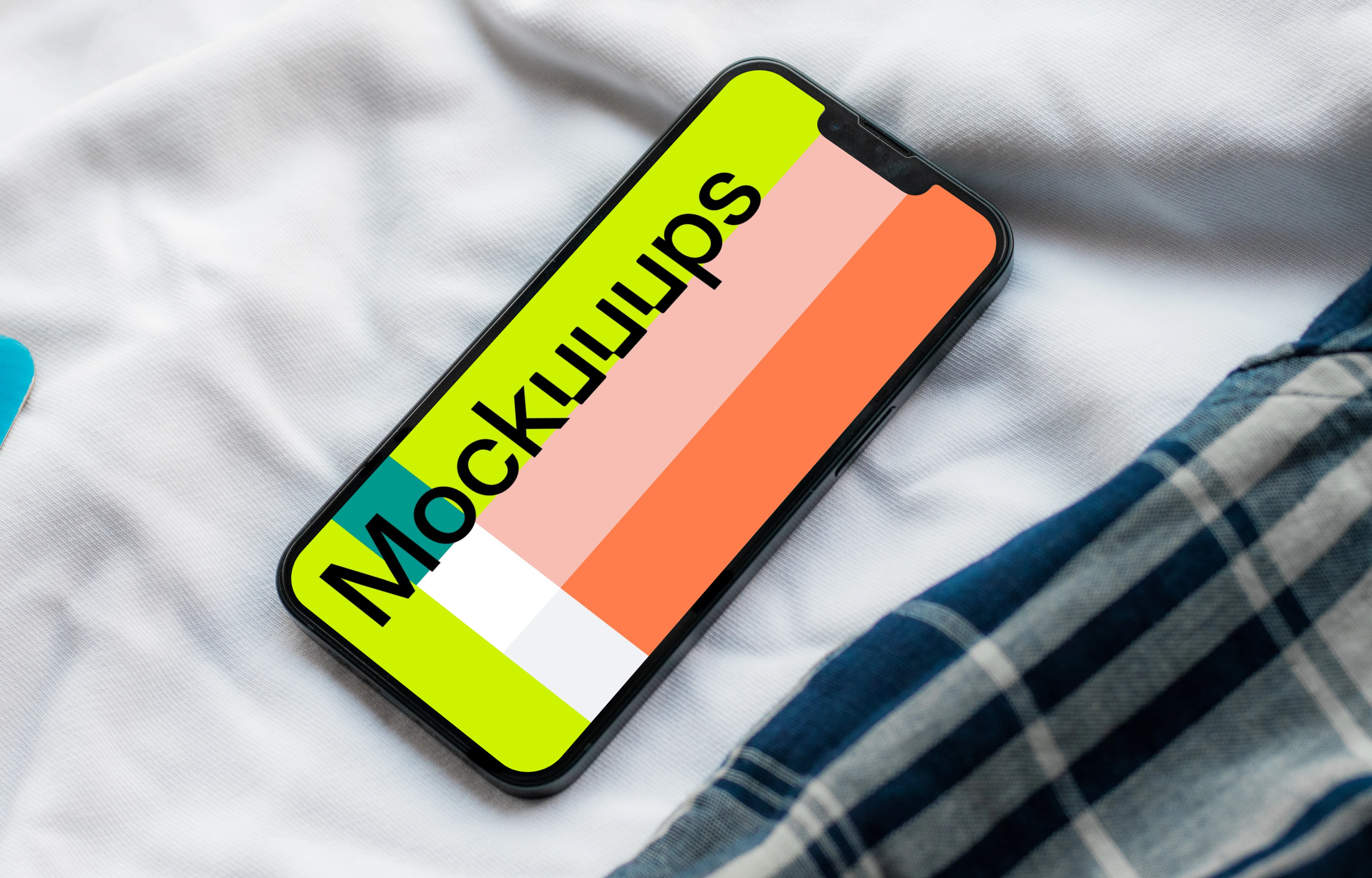 iPhone 13 mockup on bed
