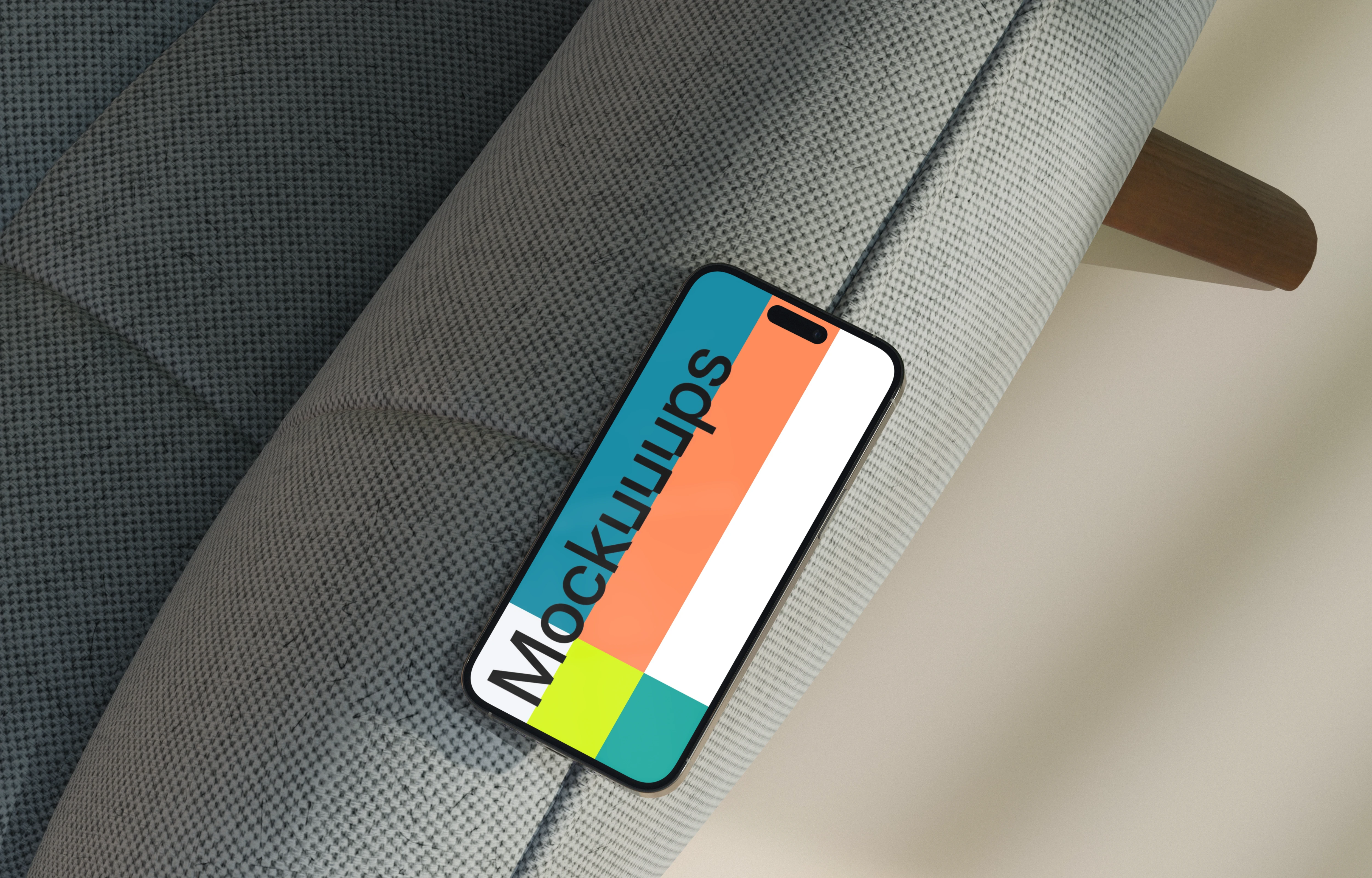 iPhone mockup on a modern fabric sofa