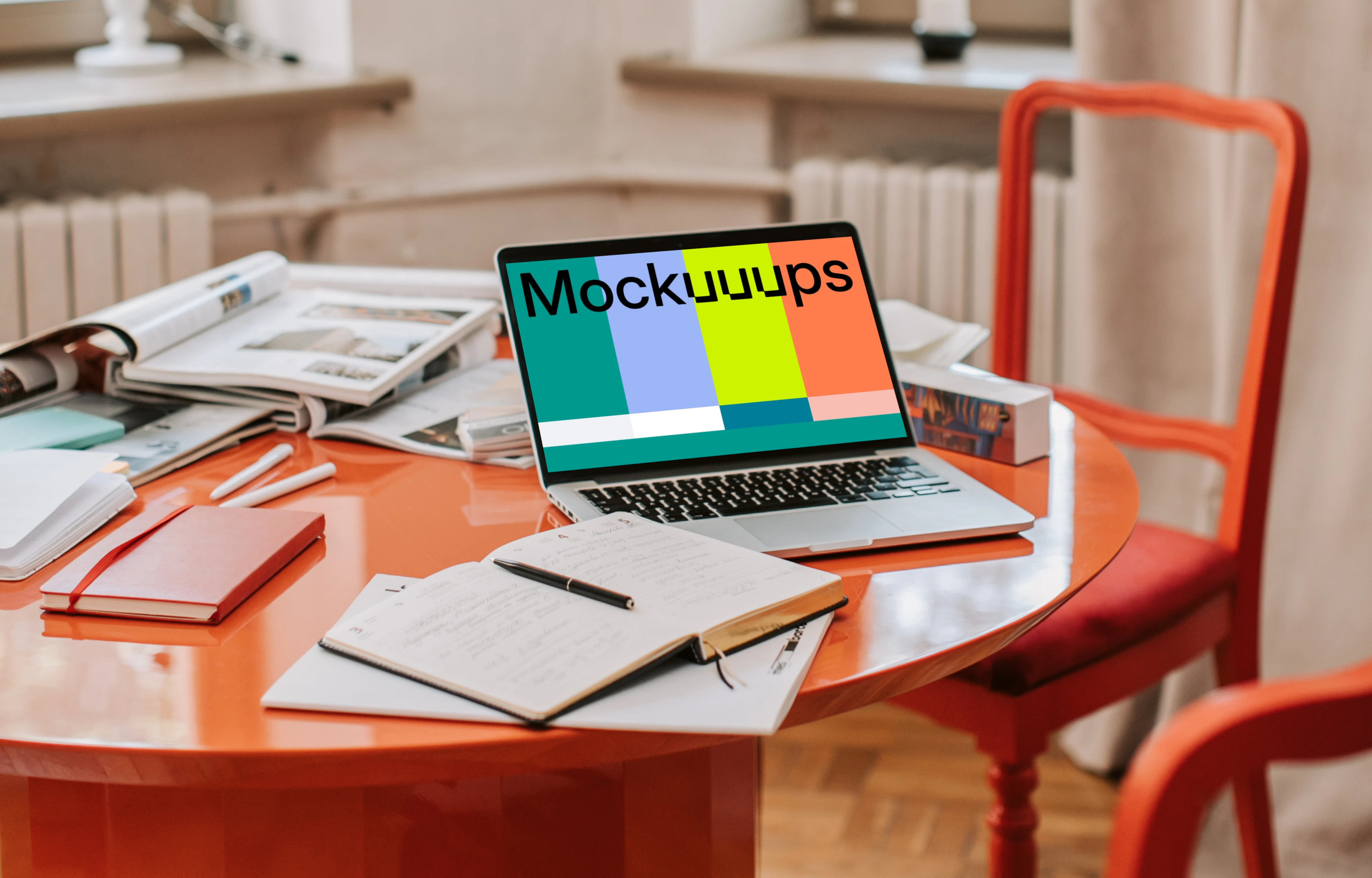 MacBook Pro mockup on a red table