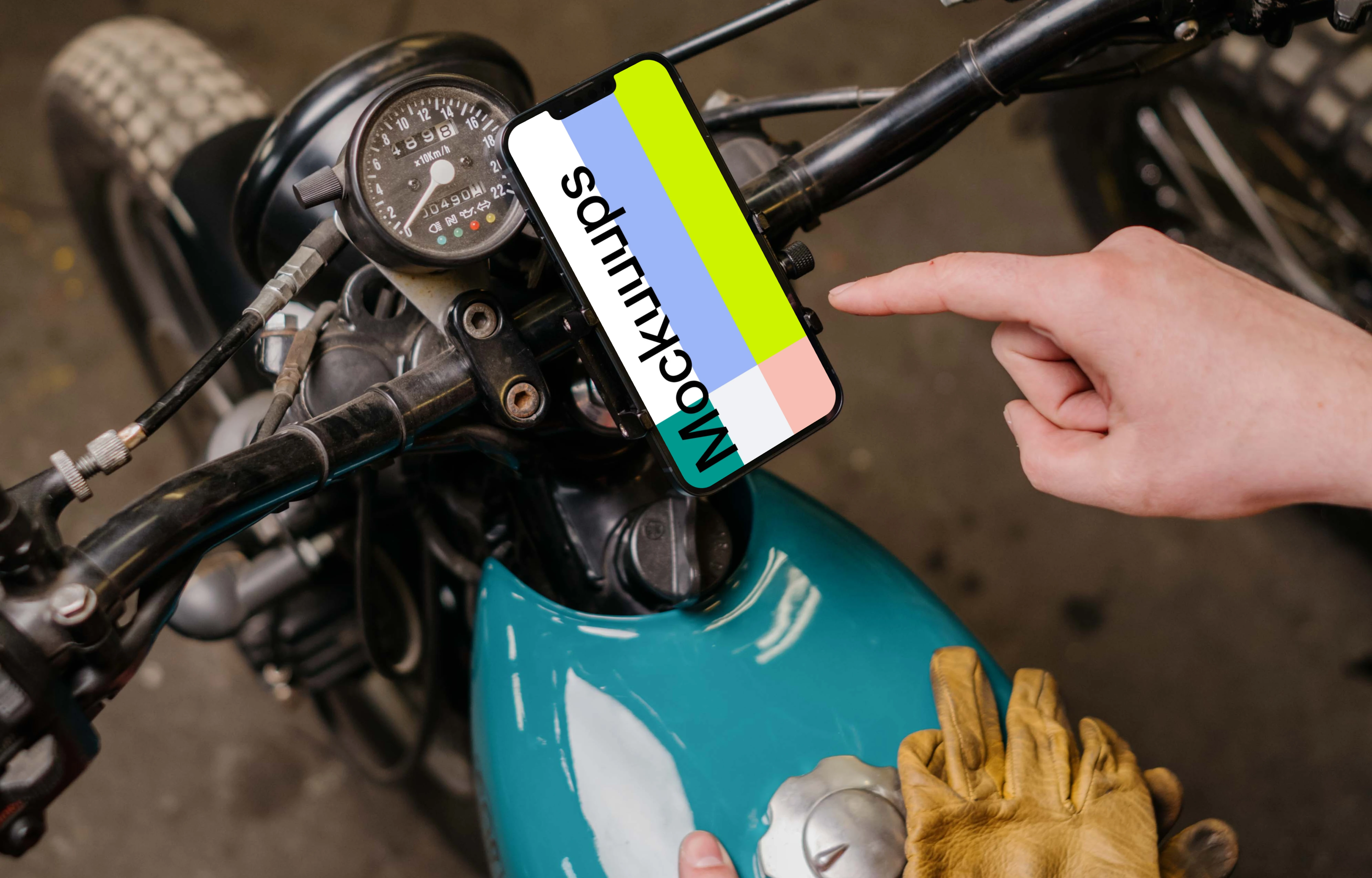Motorcycle rider using an iPhone 13 Pro mockup 