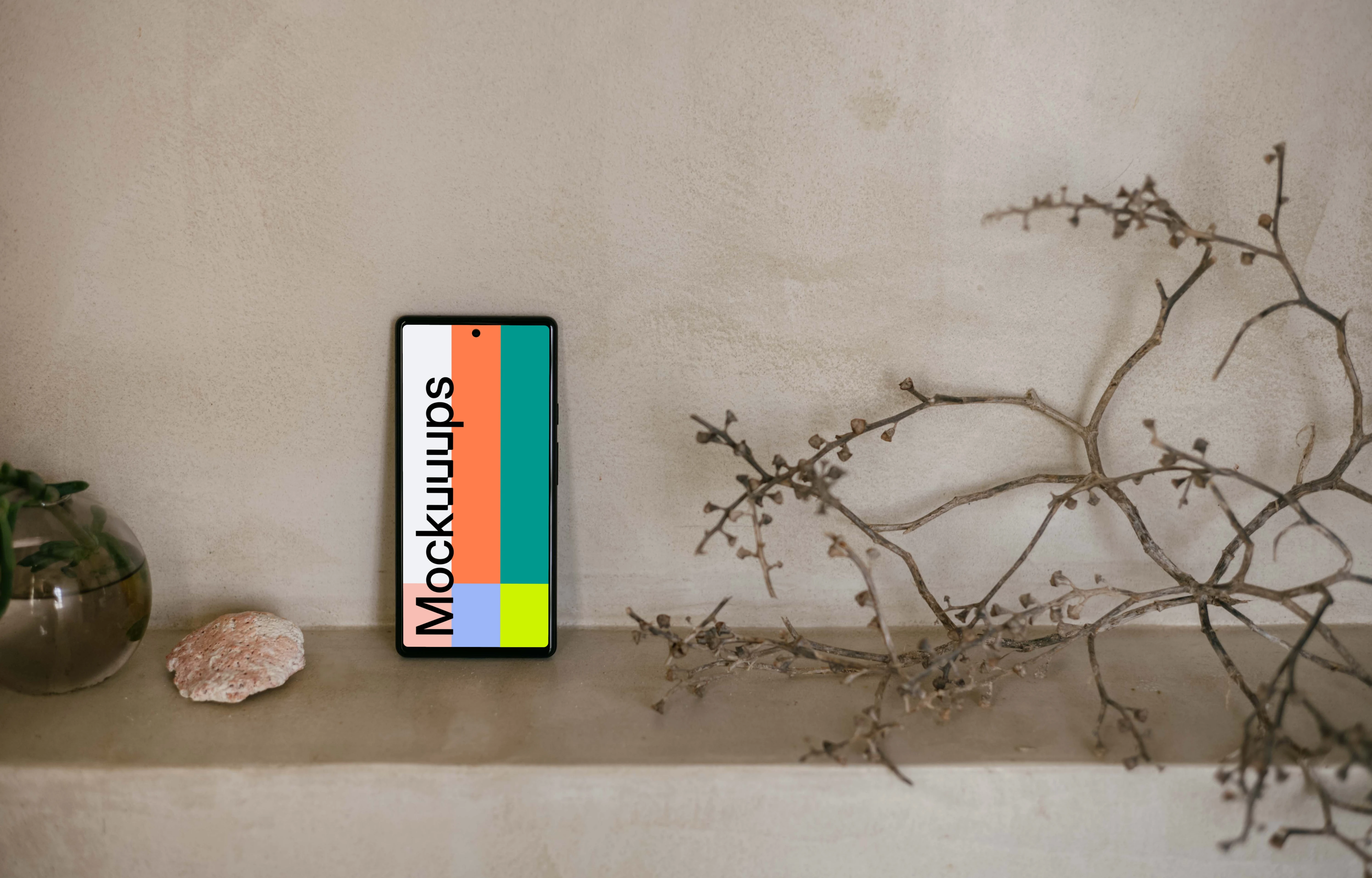 Pixel 6 mockup next to a teapot and plant