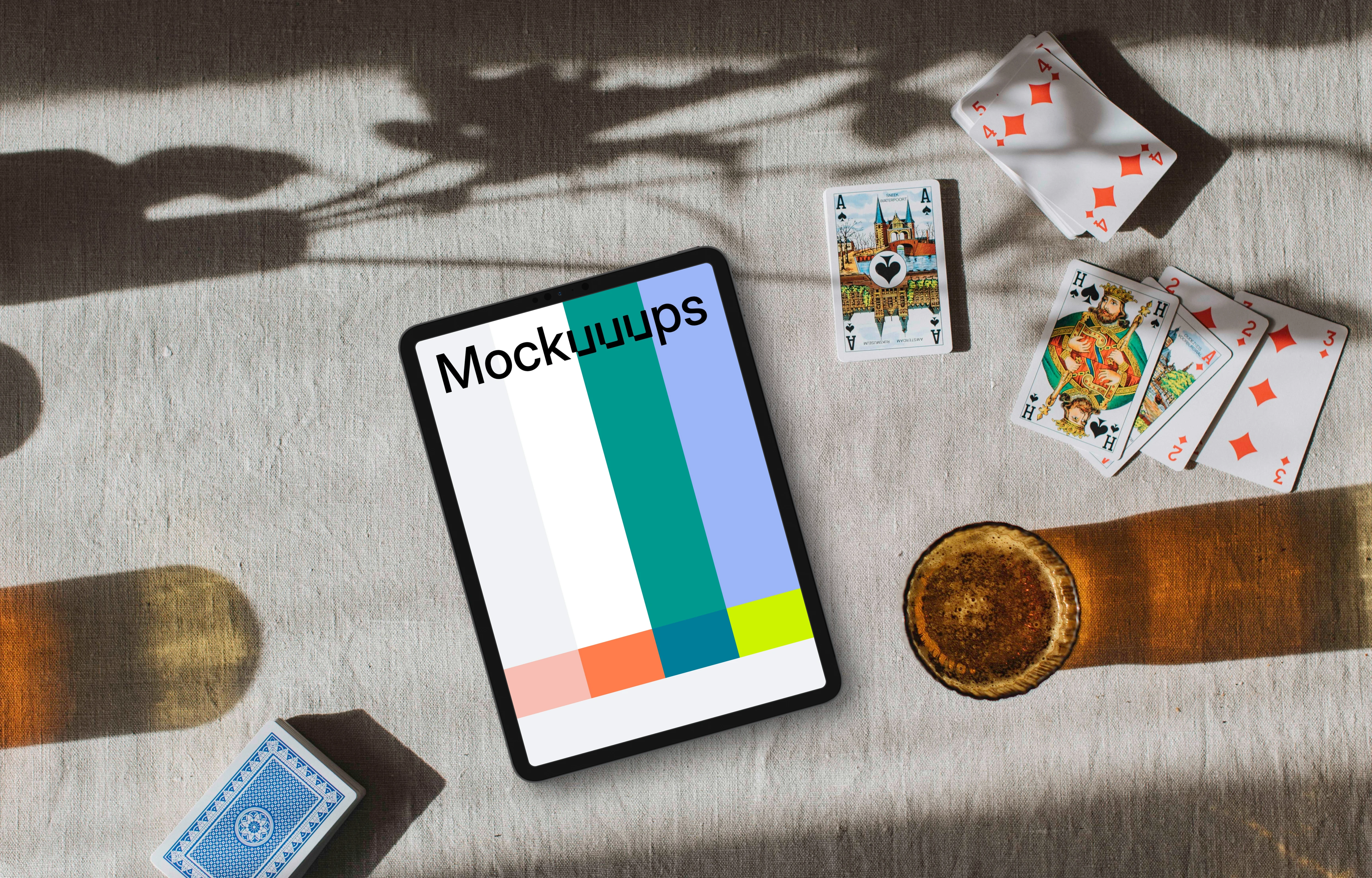 Tablet mockup in the middle of Joker cards