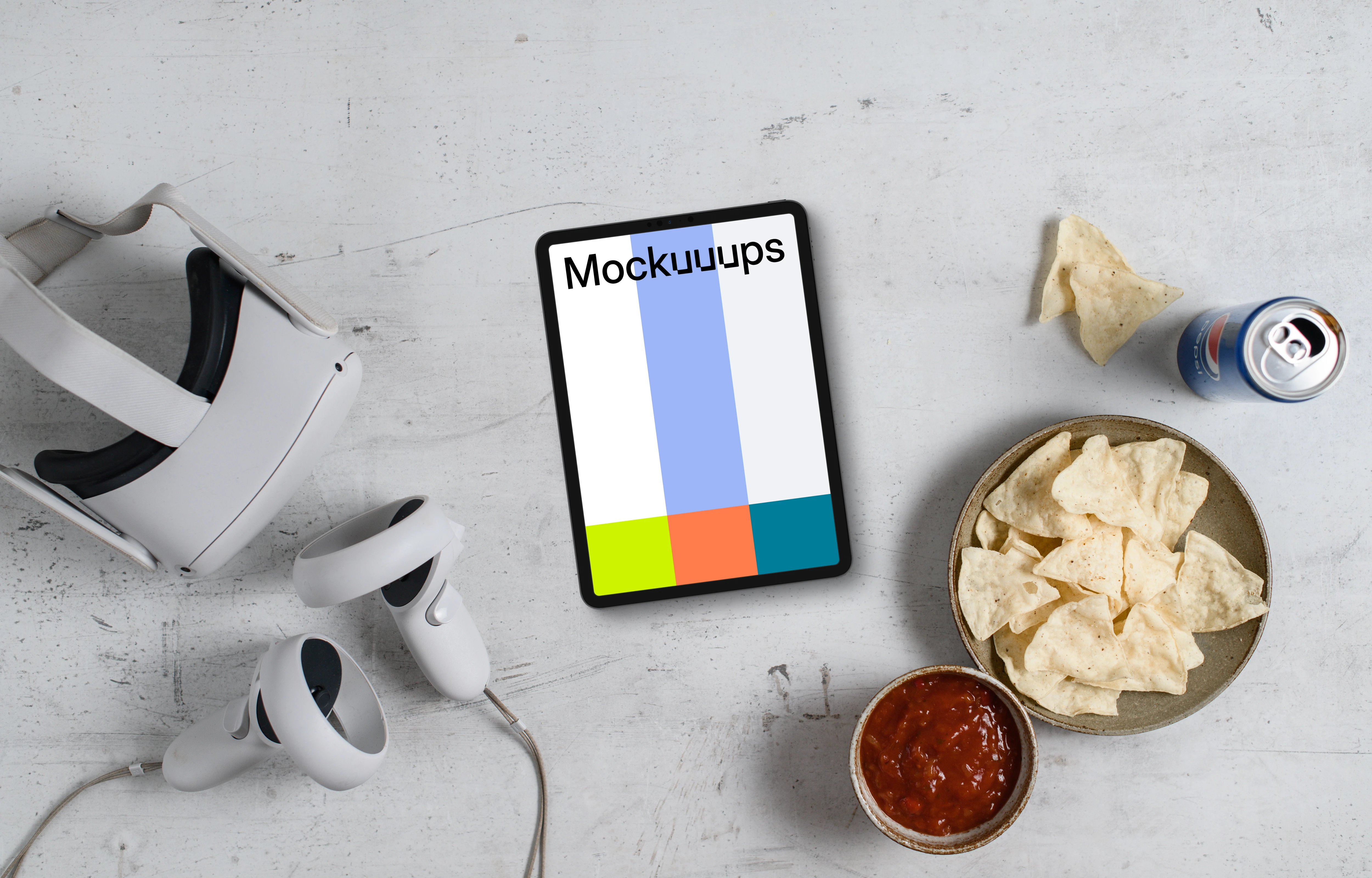 Tablet mockup with VR gaming setup and snacks