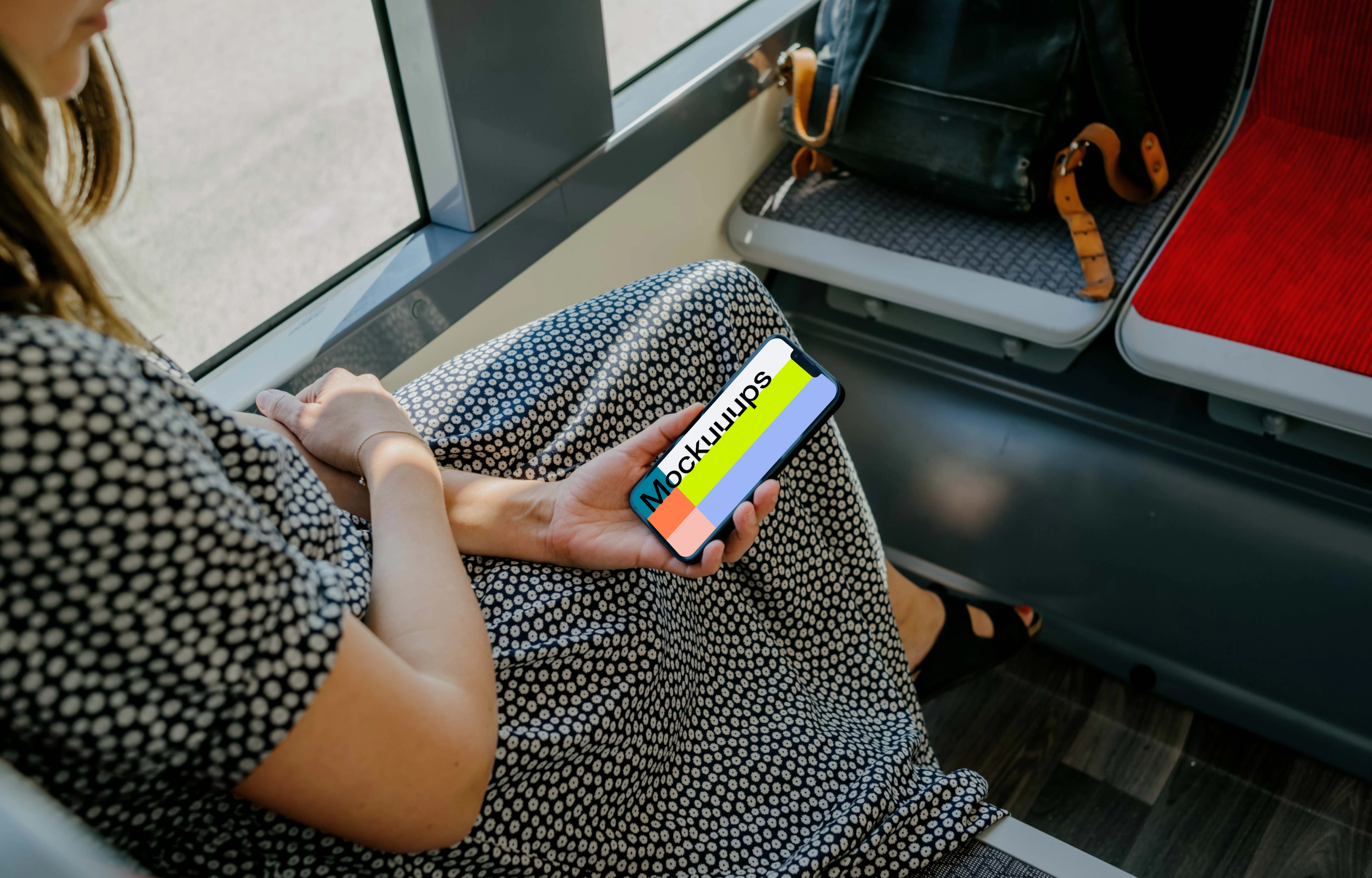 Woman hand holding an iPhone mockup