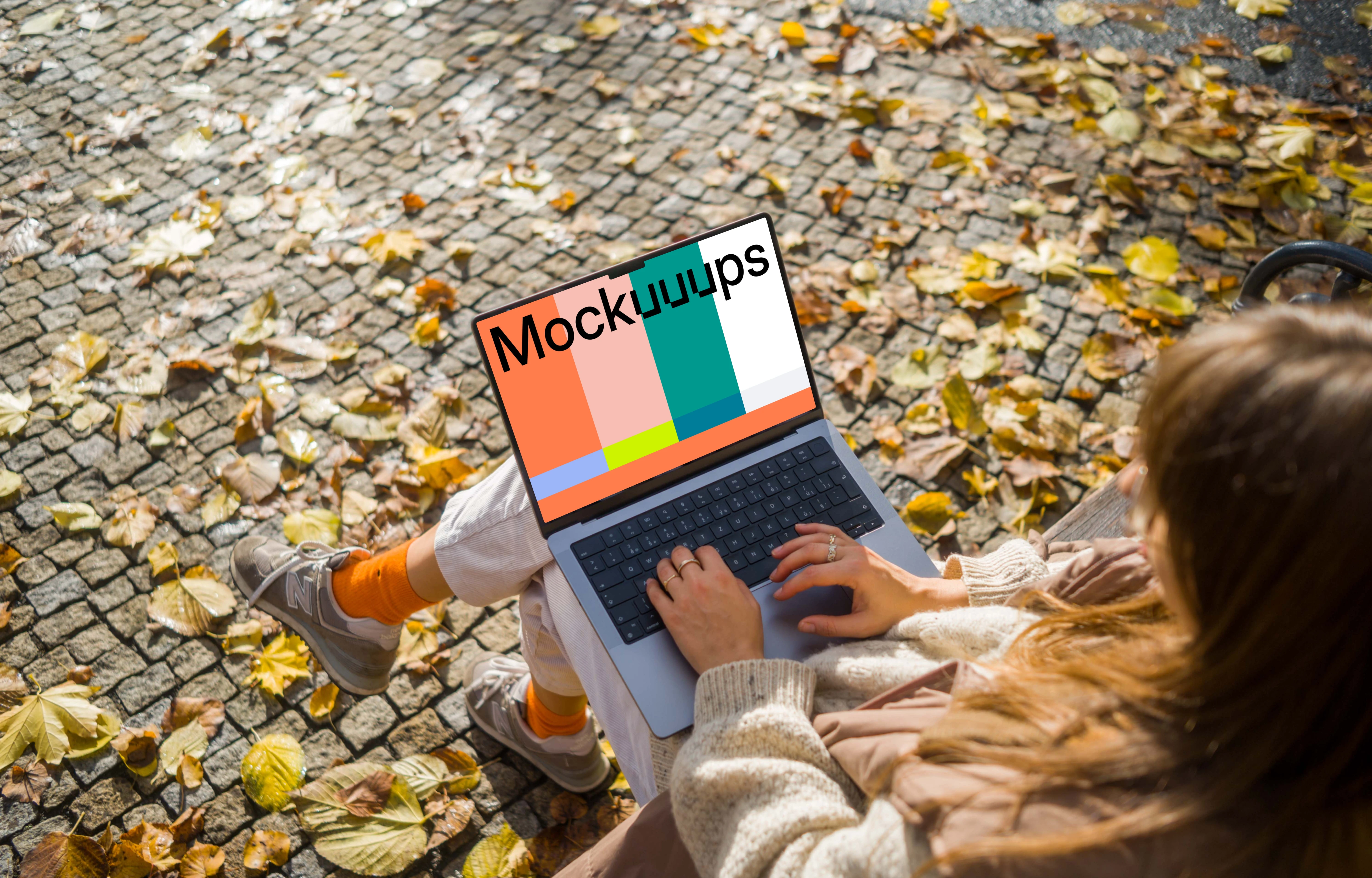 Woman working on a MacBook Pro 14 in autumn season mockup
