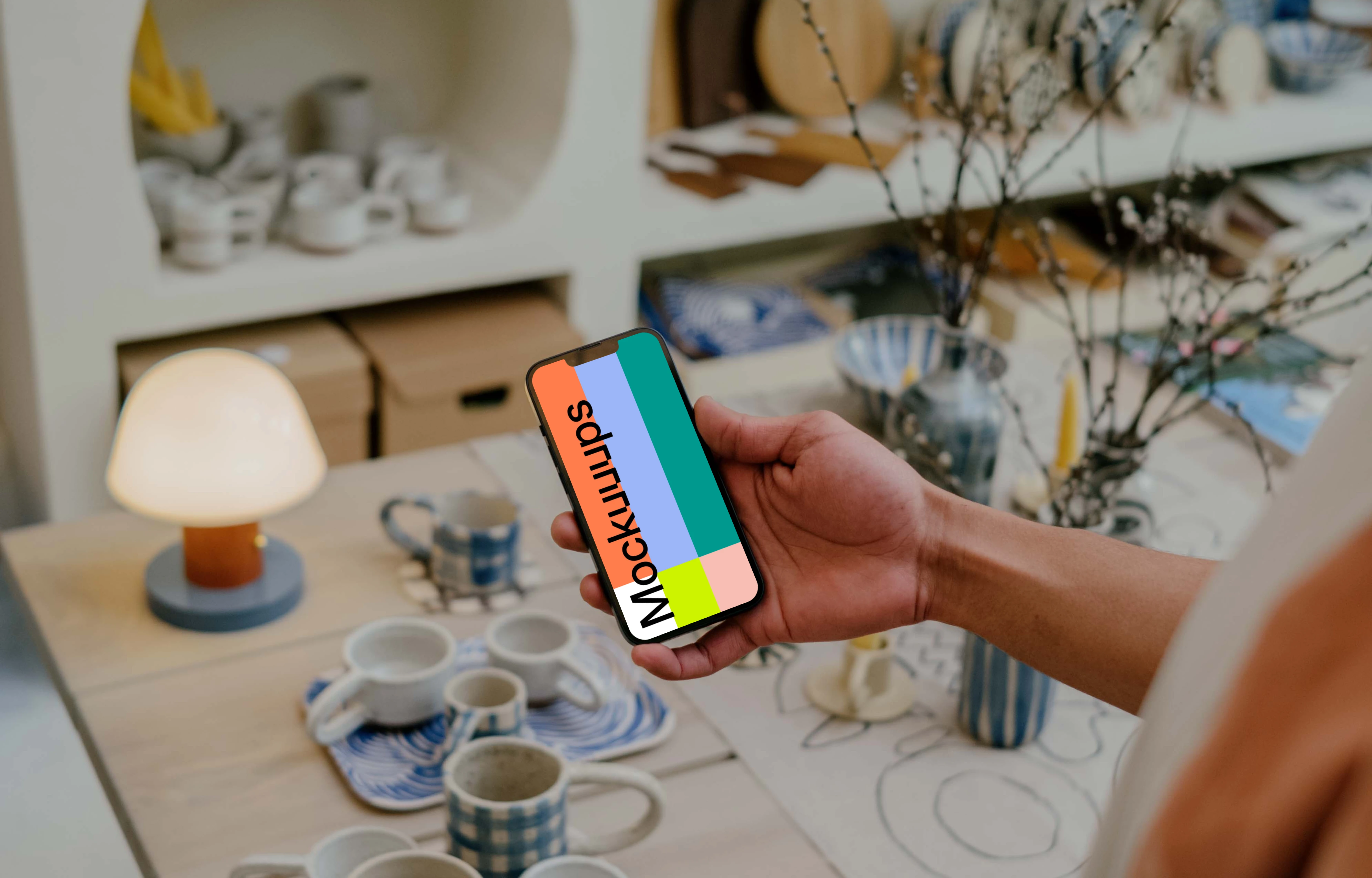 Person reading on iPhone 13 mockup