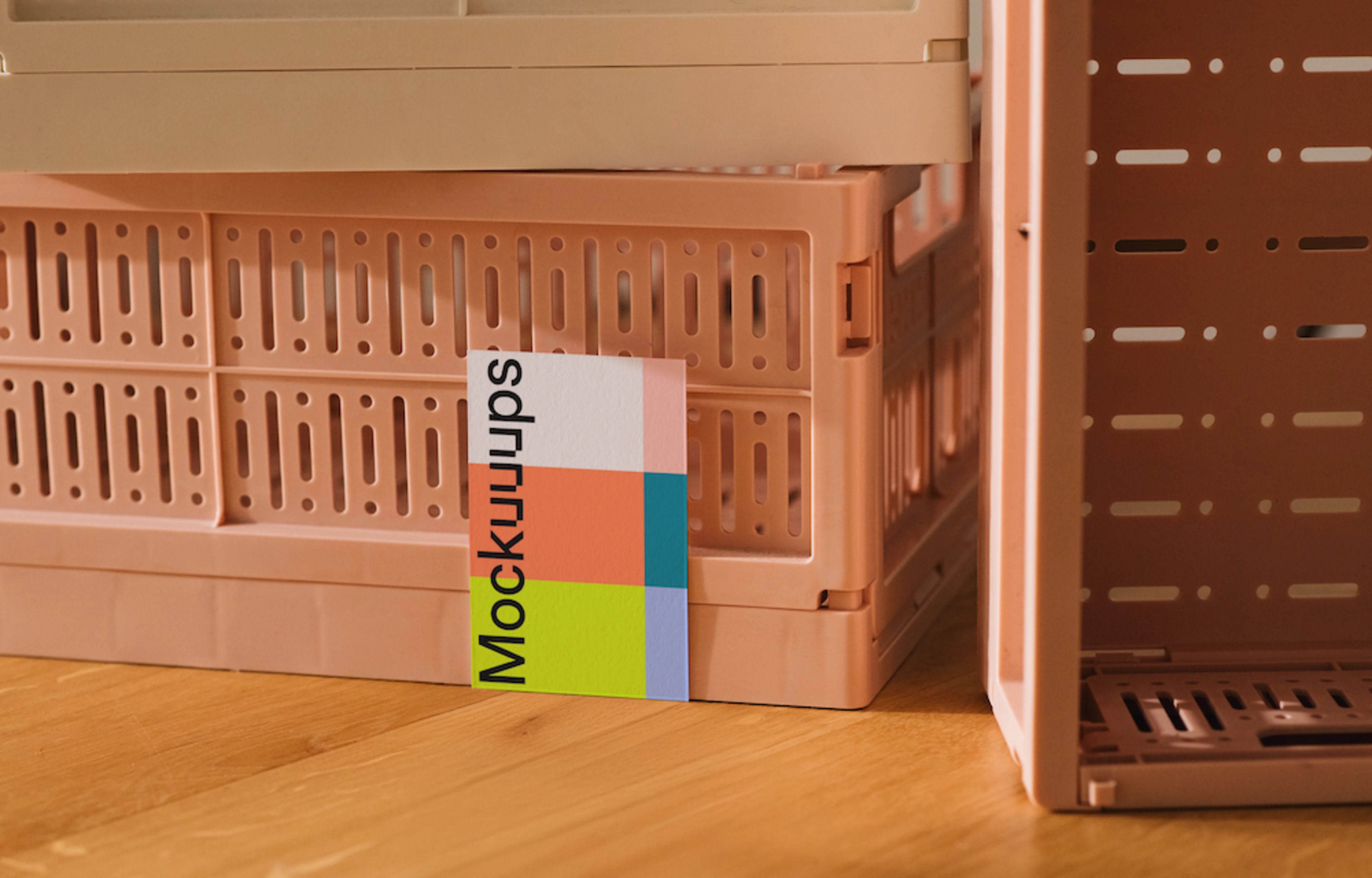 Business card mockup against patterned pink crate