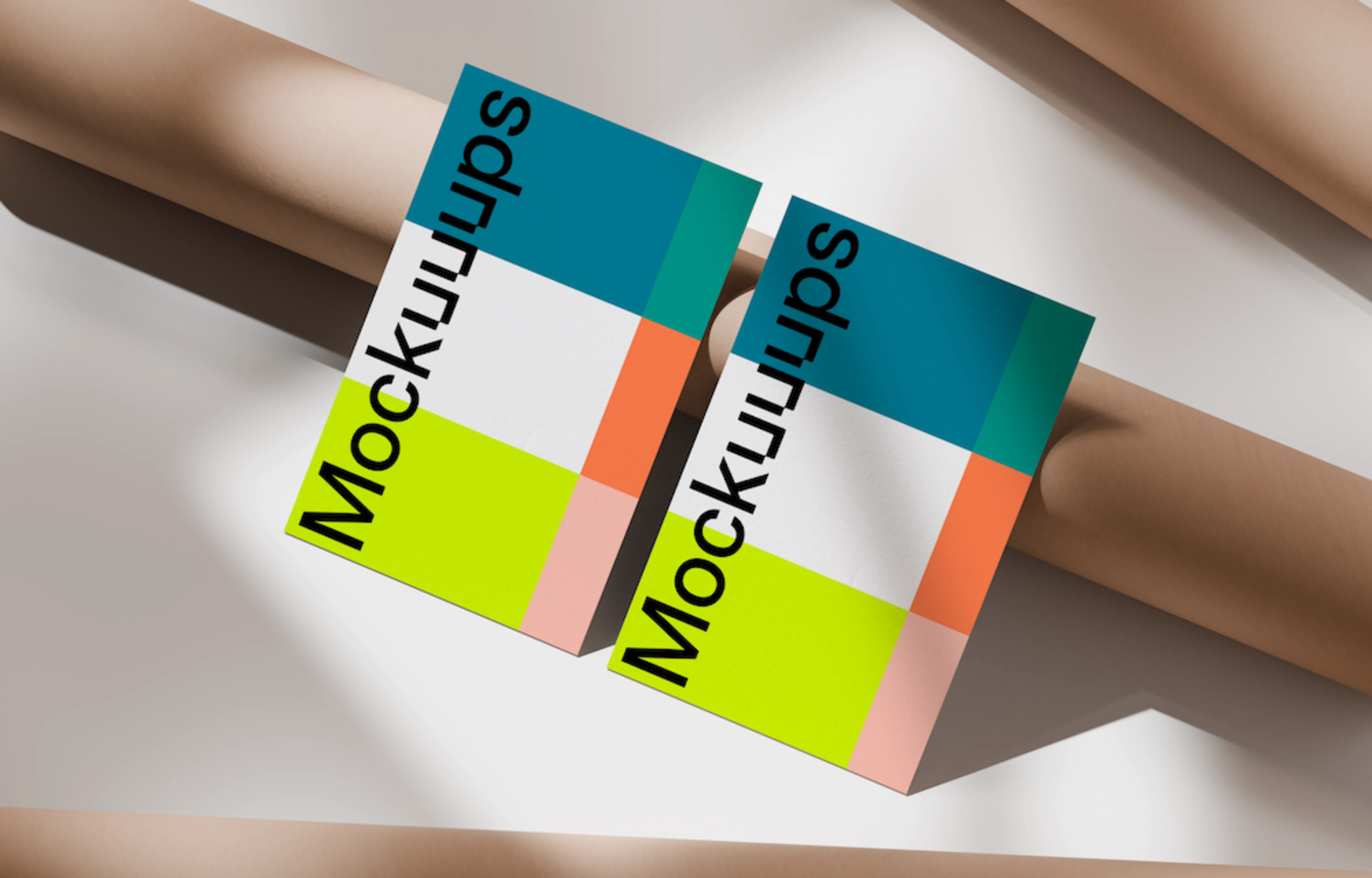 Business card mockup on rolled paper backdrop