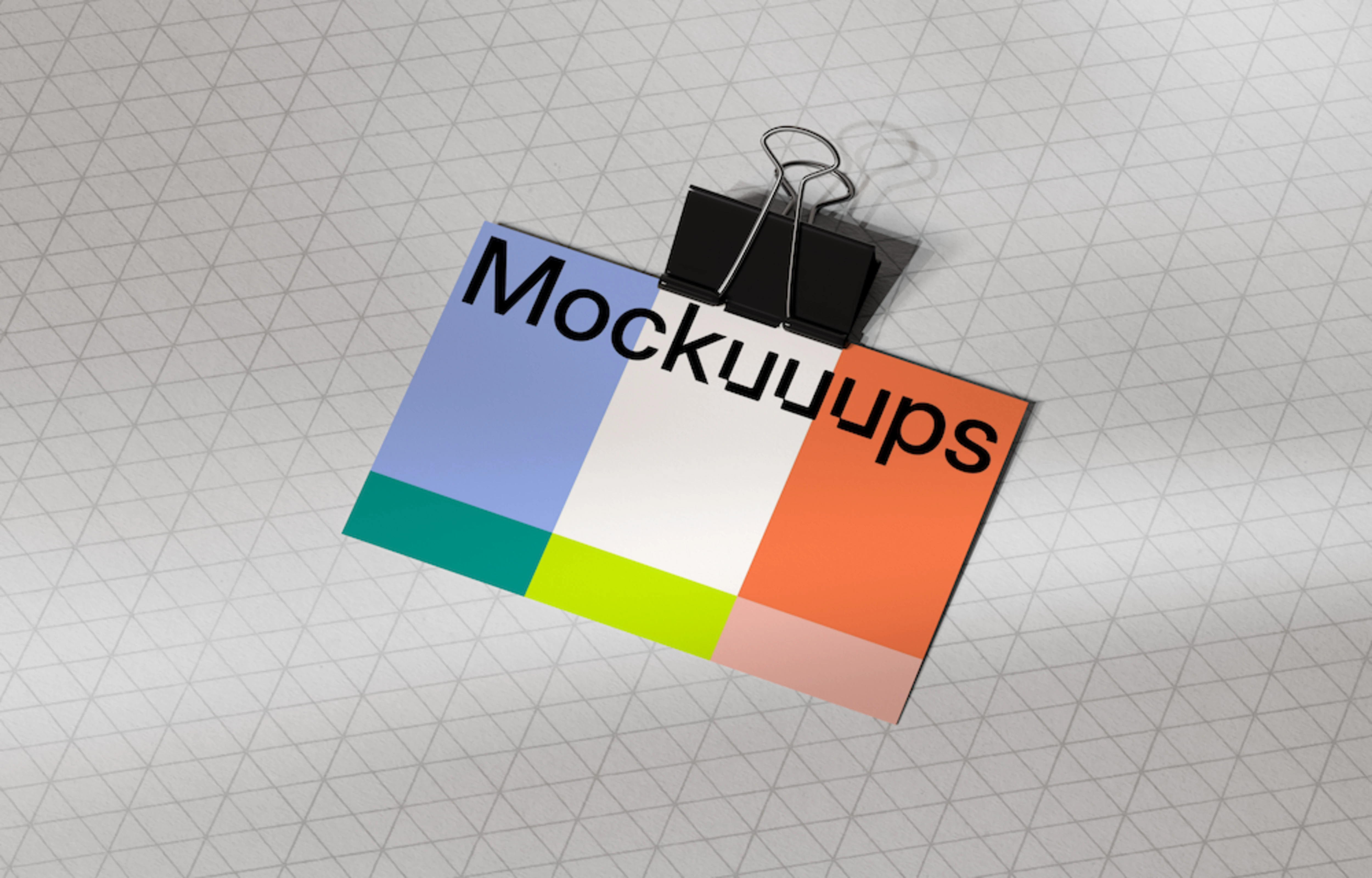 Business card mockup with black clip on patterned surface