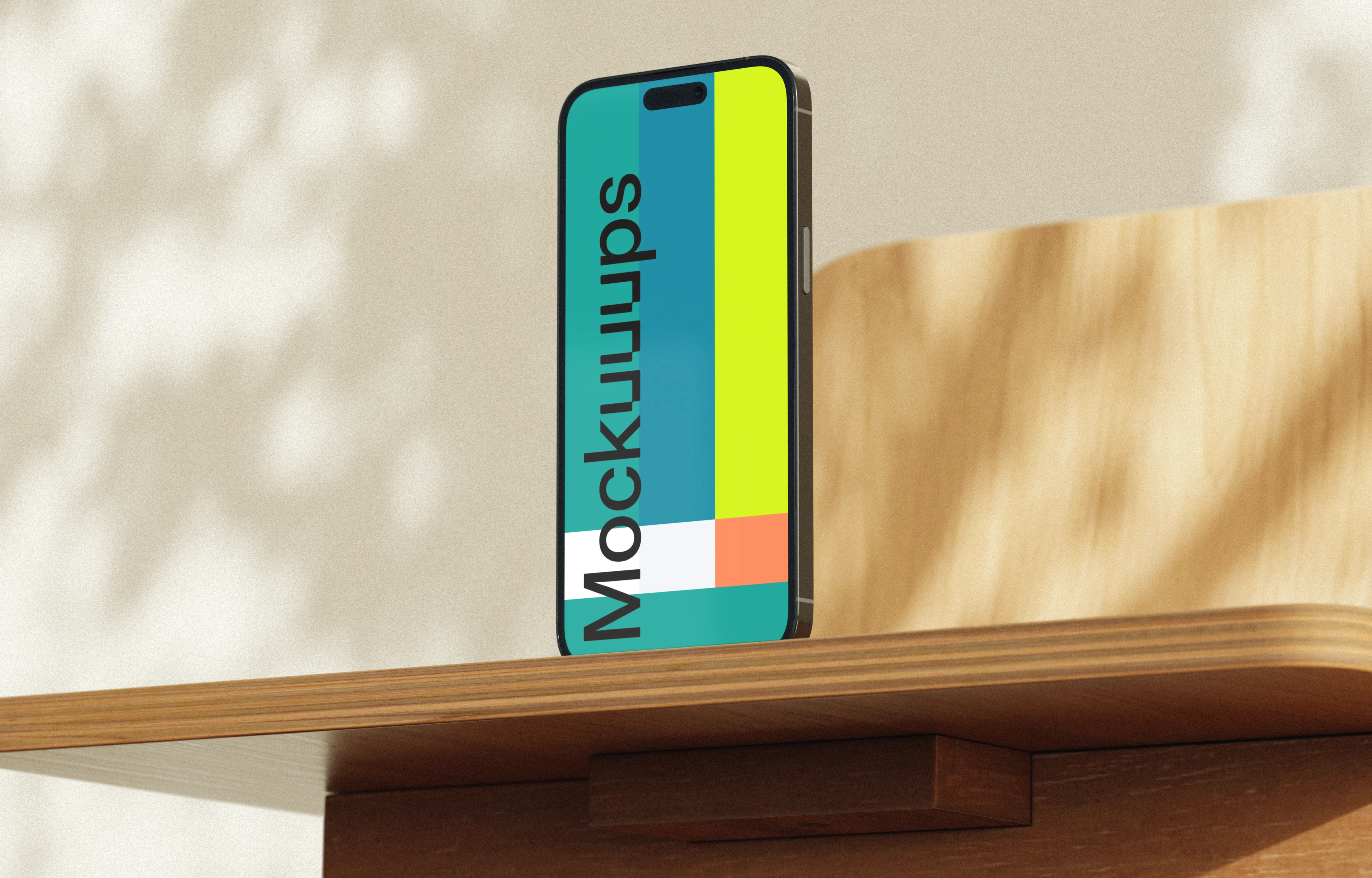 Free iPhone mockup on a wooden desk in sunlight
