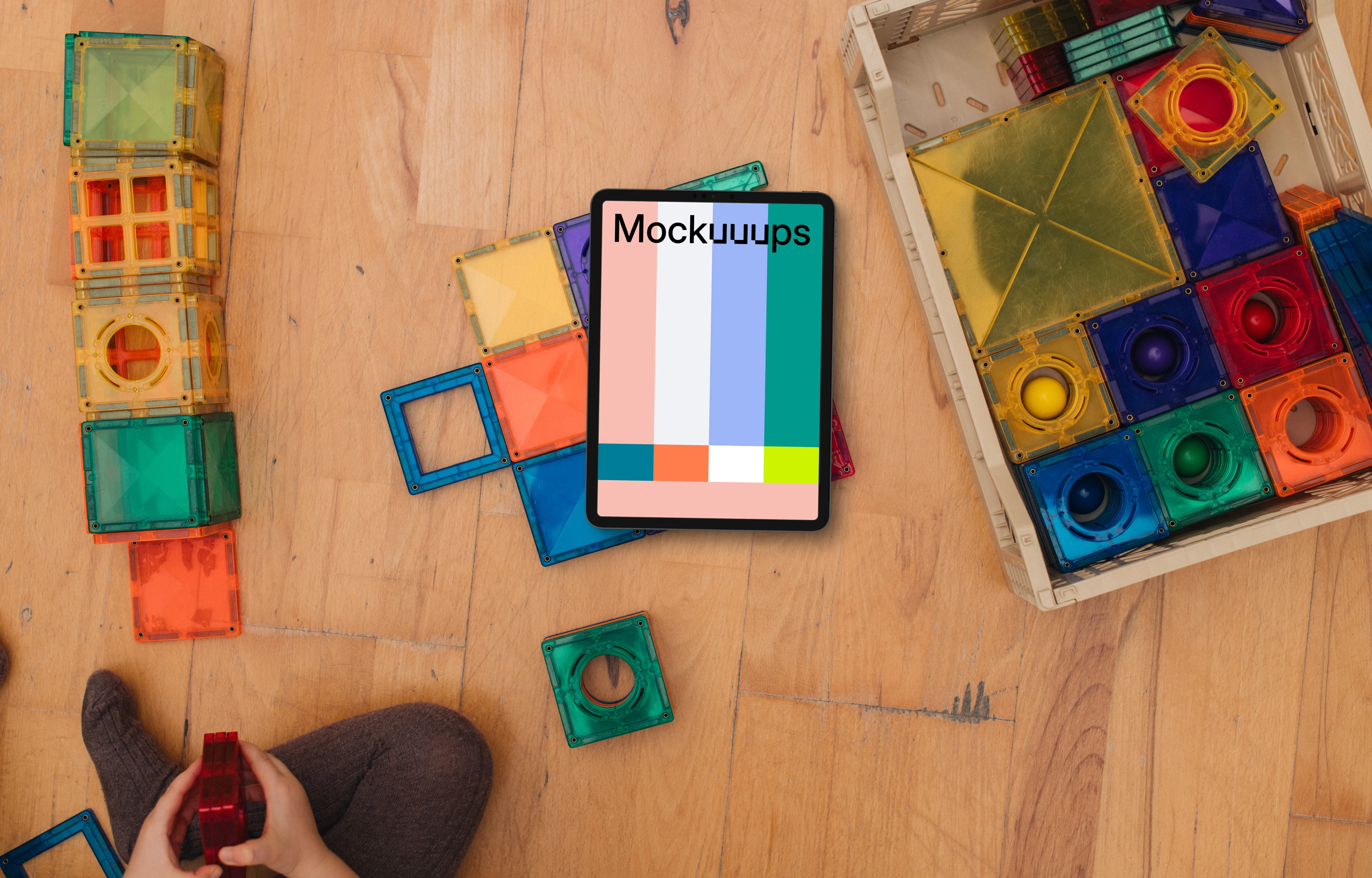 Tablet mockup surrounded by colorful building blocks