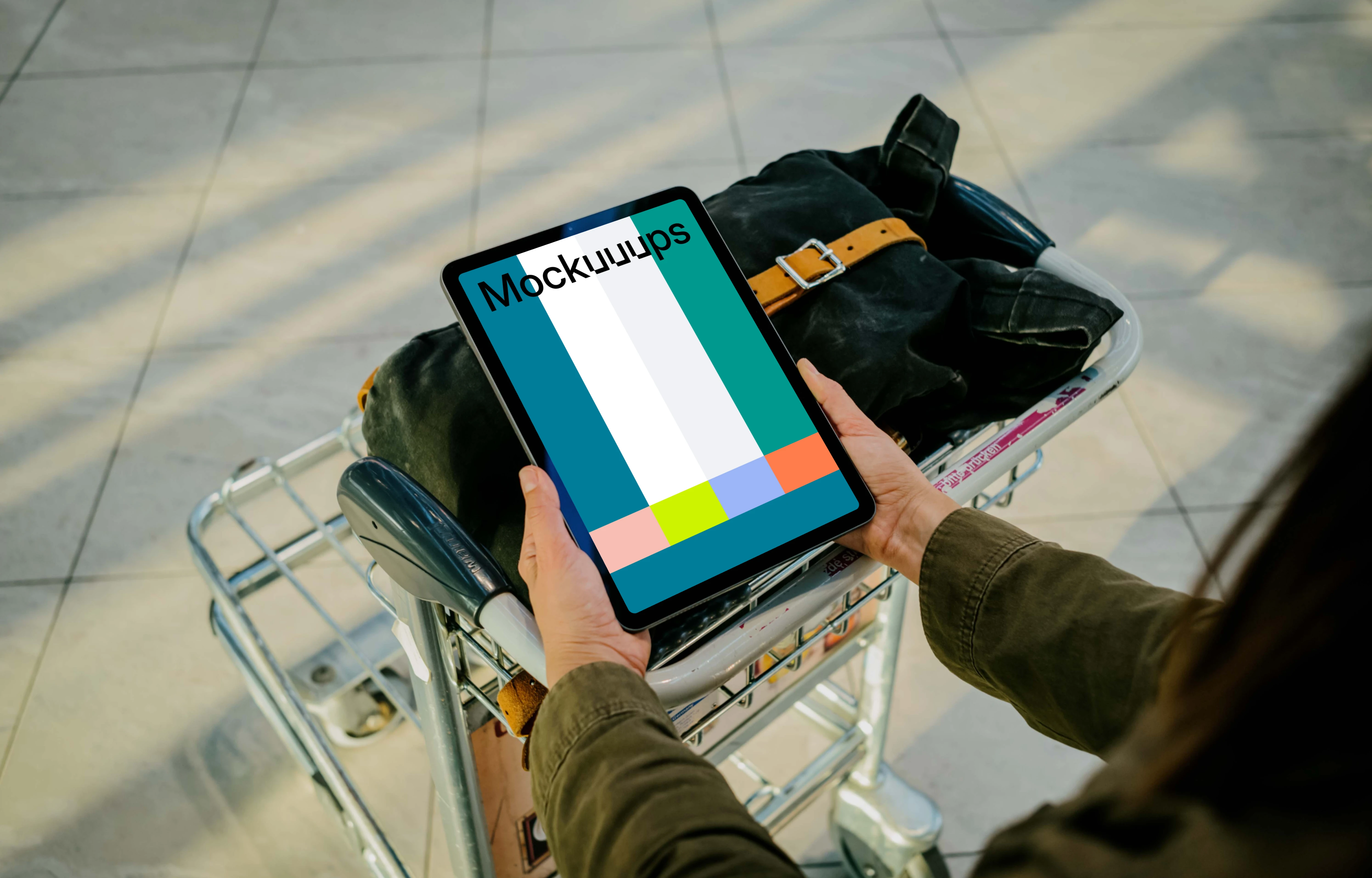 Hands holding an iPad Air mockup