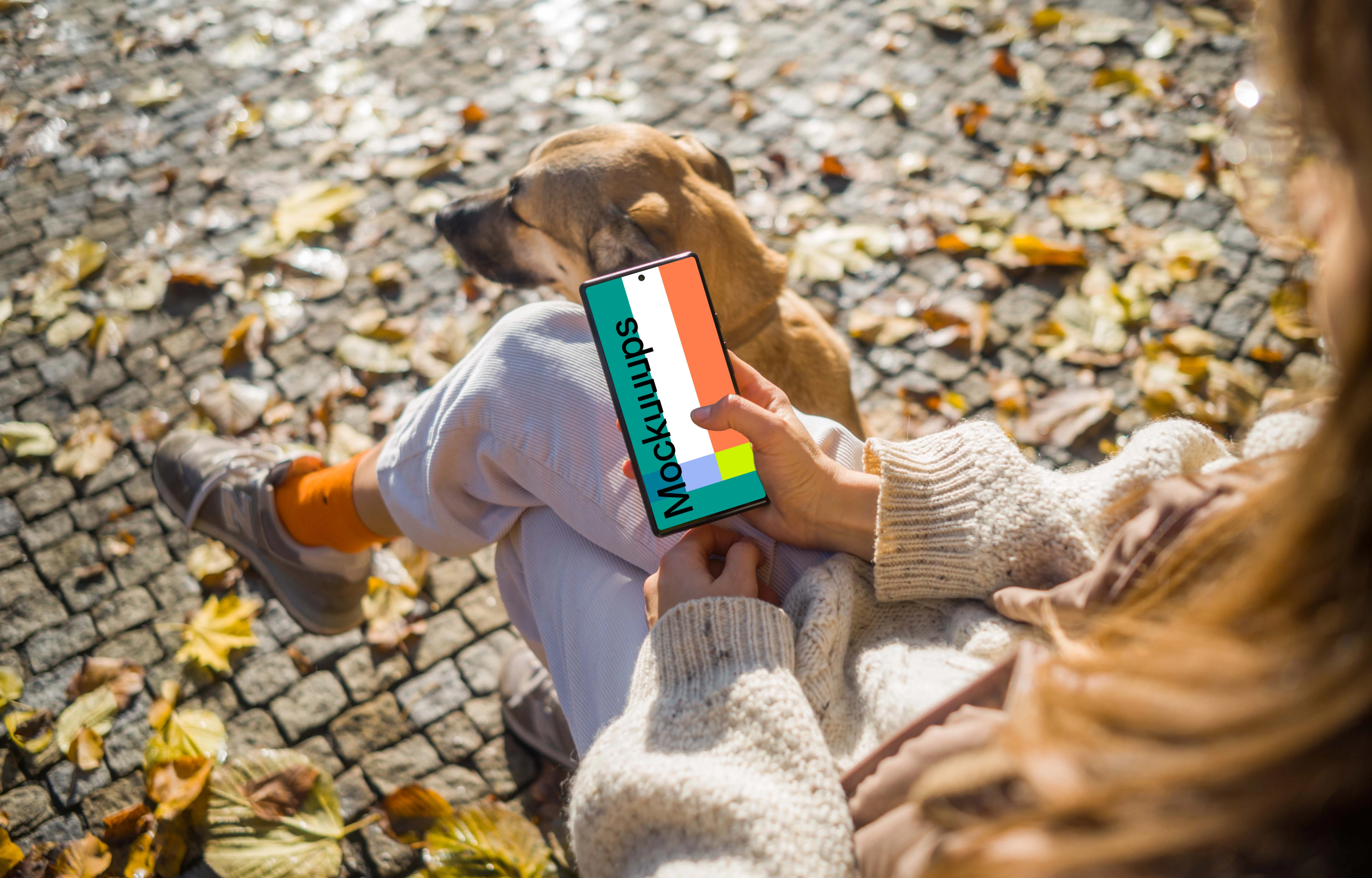 Woman scrolling on a Google Pixel 6 sitting next to dog mockup