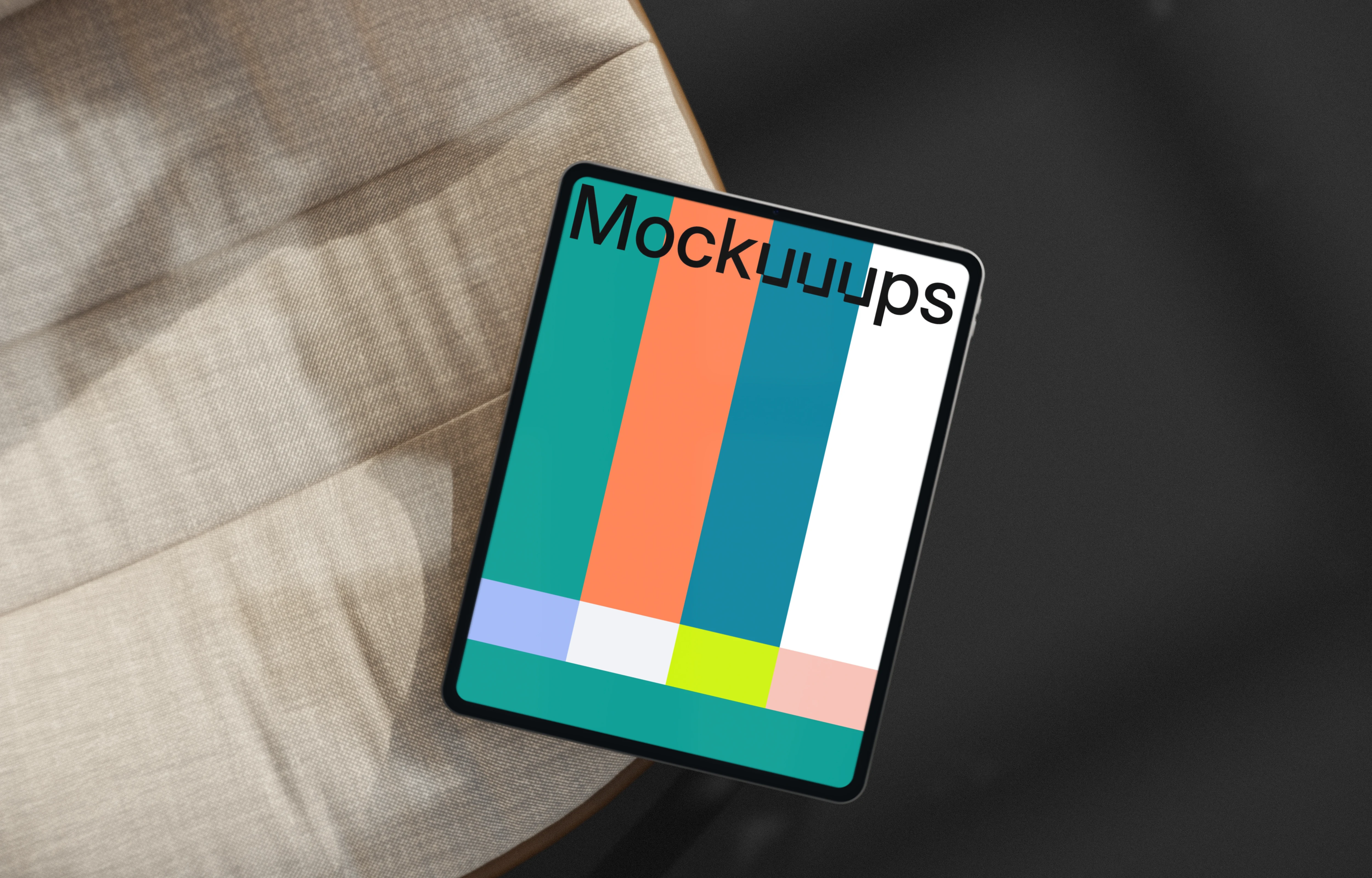 iPad Pro mockup on a modern fabric chair