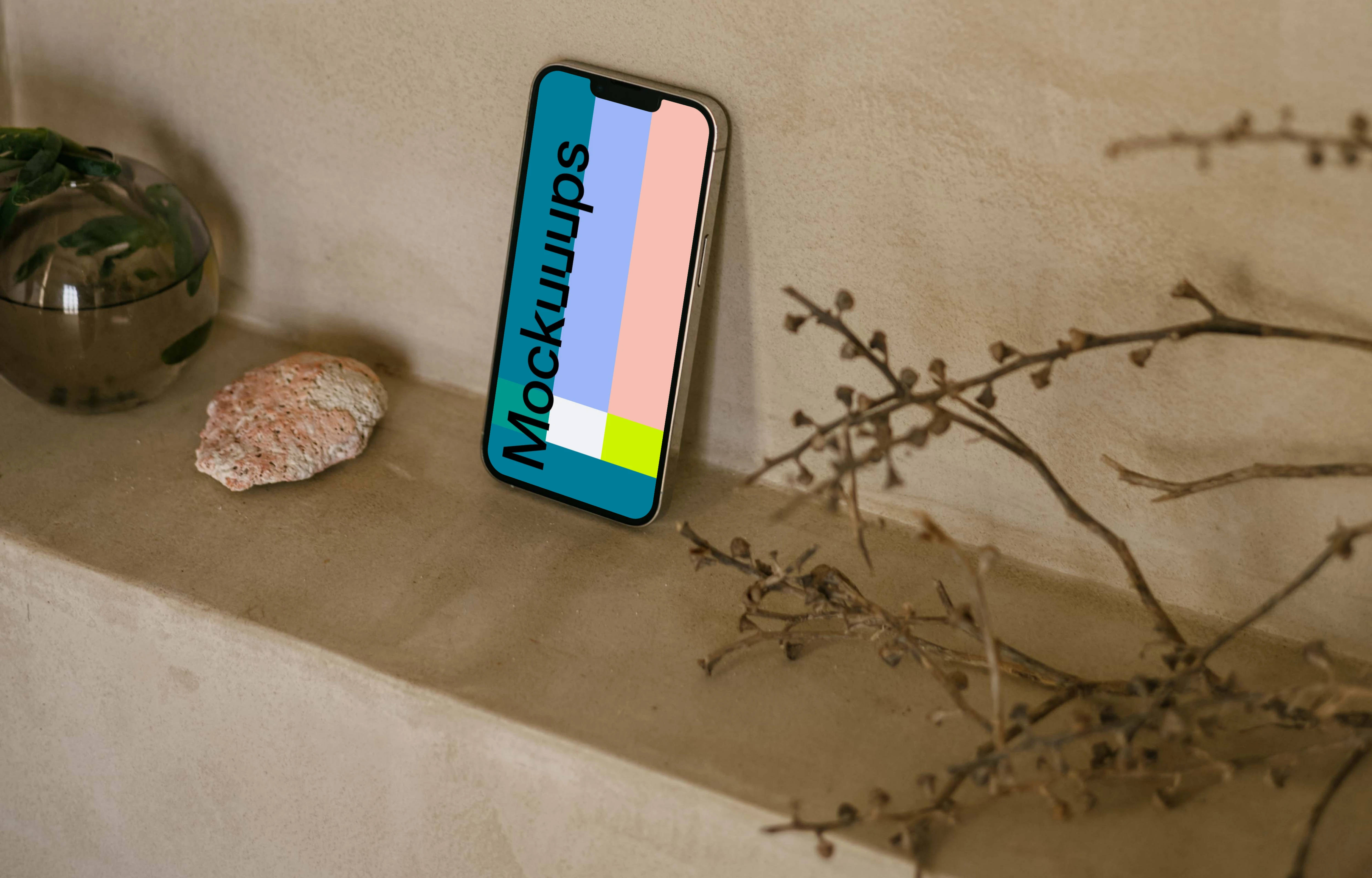 iPhone 13 Pro mockup next to a teapot and plant