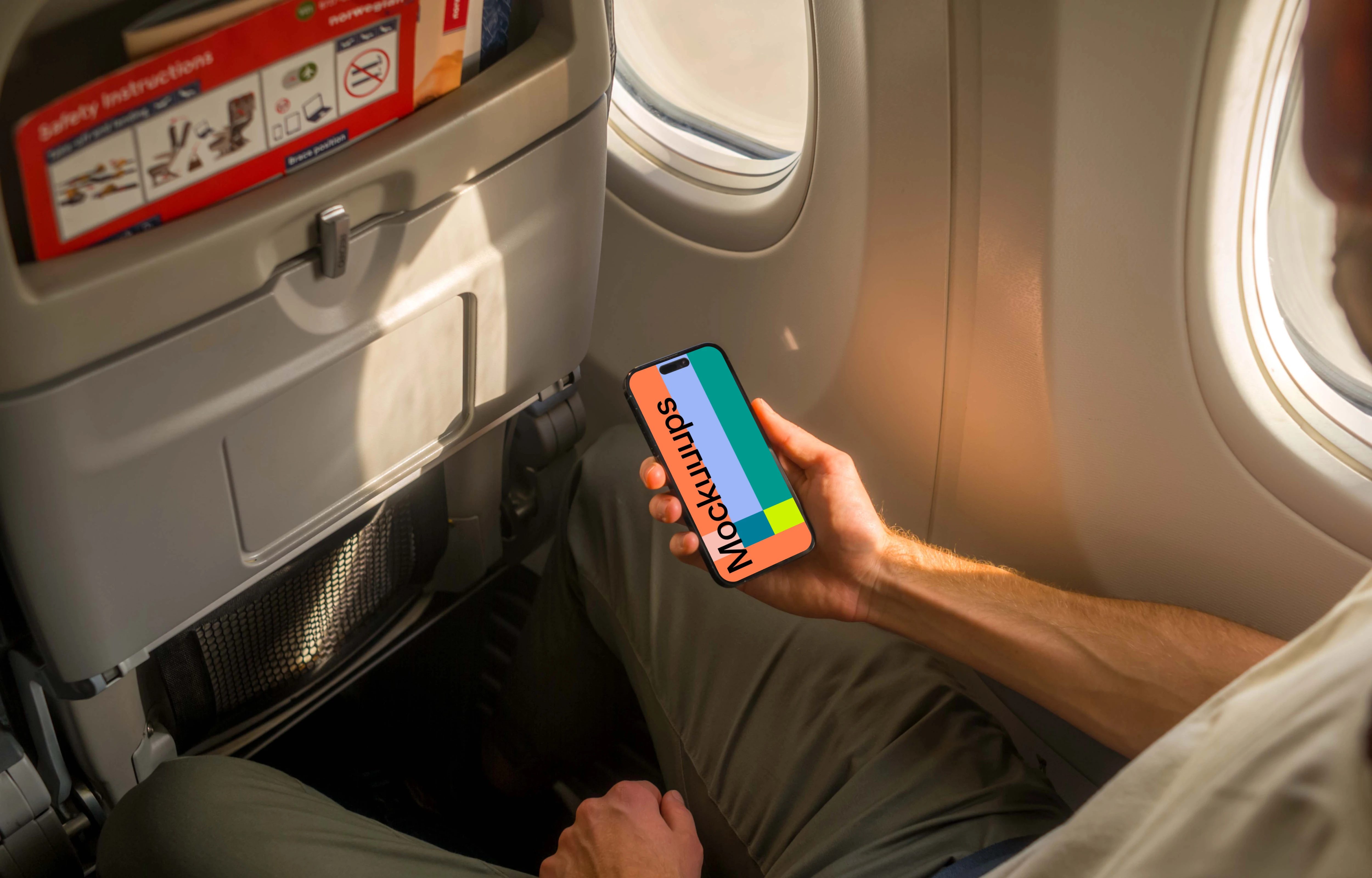 Free iPhone 14 Pro on a Plane Mockup
